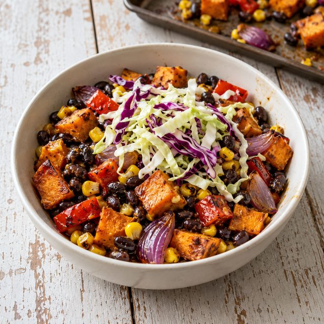 Sheet-Pan Smoky Sweet Potato and Black Bean Bowls with Lime Slaw